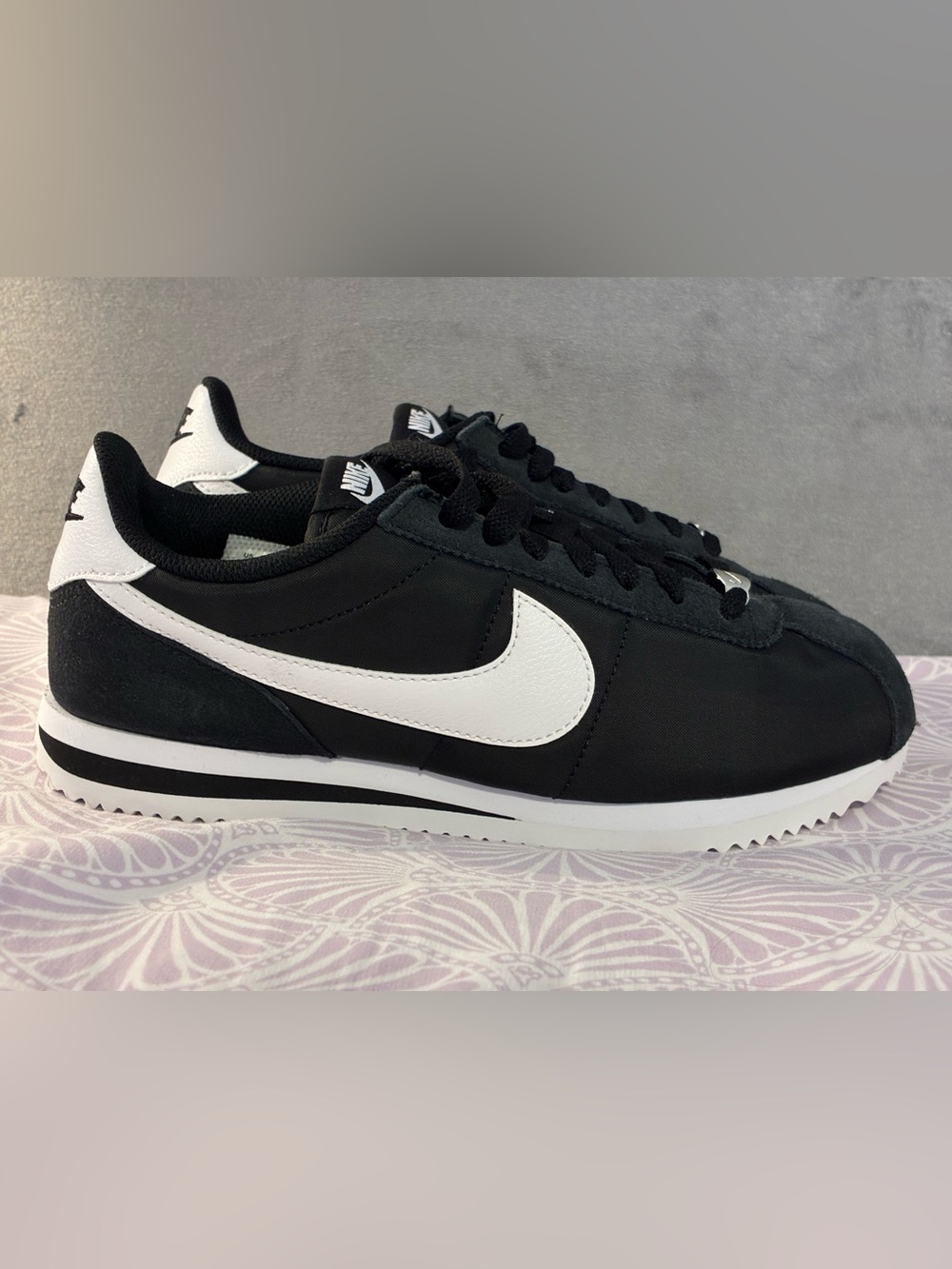 Nike Cortez Men’s or Women’s Black and White Low-Profile Sneaker with Swoosh